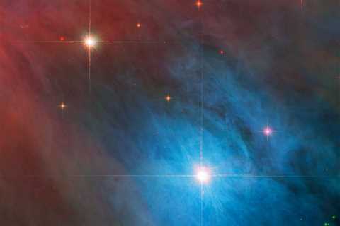 NASA Hubble Photo Shows Twinkling Lights Sparkling Through Technicolor Gas